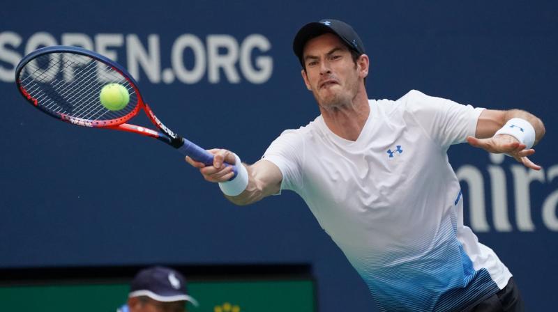 Murray said the shadows cast in the massive Arthur Ashe Stadium provided a slight respite from sweltering temperatures. (Photo: AFP)