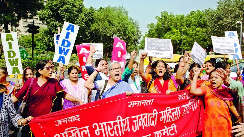 Women shout slogans during a protest against sexual harassment at the  workplace in New Delhi on Friday.  (AP)