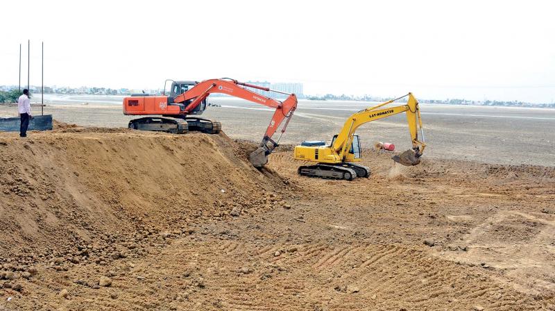 Bund strengthening works in progress at Korattur lake.