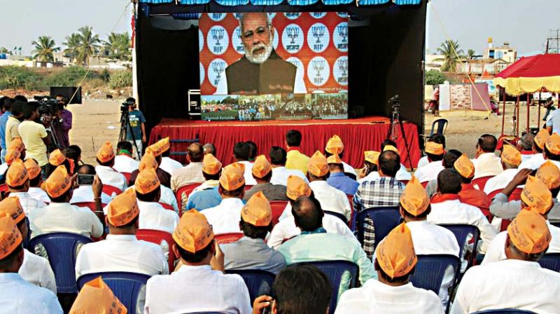 PM Modi during a video conference with BJP workers, in Davangere on Friday 	 KPN