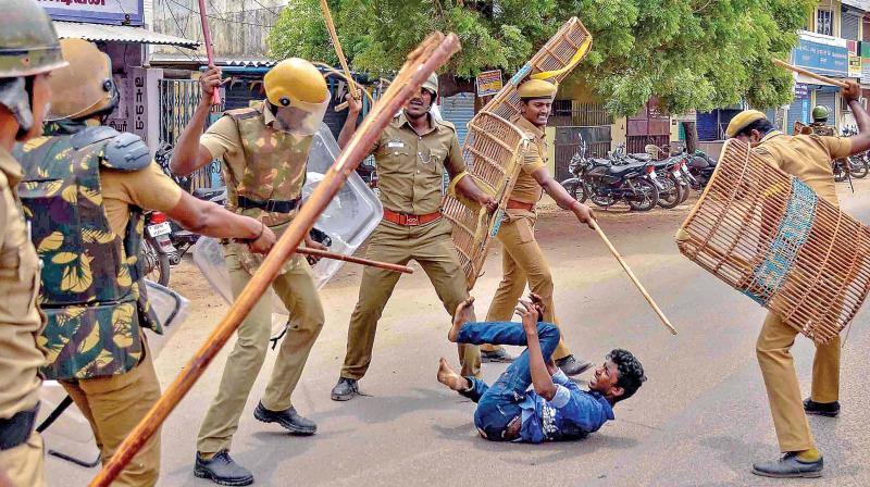 Police personnel lathicharge at a protester demanding the closure of Vedantas Sterlite Copper unit in Tuticorin on Wednesday (Photo: AP)