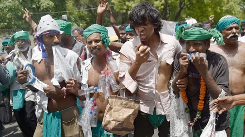 Tamil farmers dressed up in tattered clothes to act like insane people during their agitation demanding loan waiver and compensation for crop failure, at Jantar Mantar in New Delhi on Wednesday. (Photo: PTI)