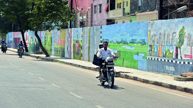 Arty stretch: The artists are also painting a wall along the Necklace Road. The aim is to break the visual monotony commercial advertisements and hoardings are causing
