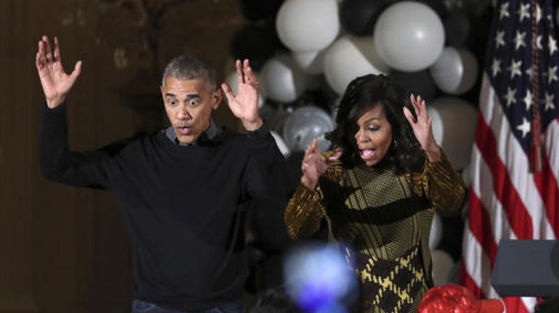 President Barack Obama and the first lady Michelle Obama dance to the beat of Michael Jacksons \Thriller\. (Photo: AP)