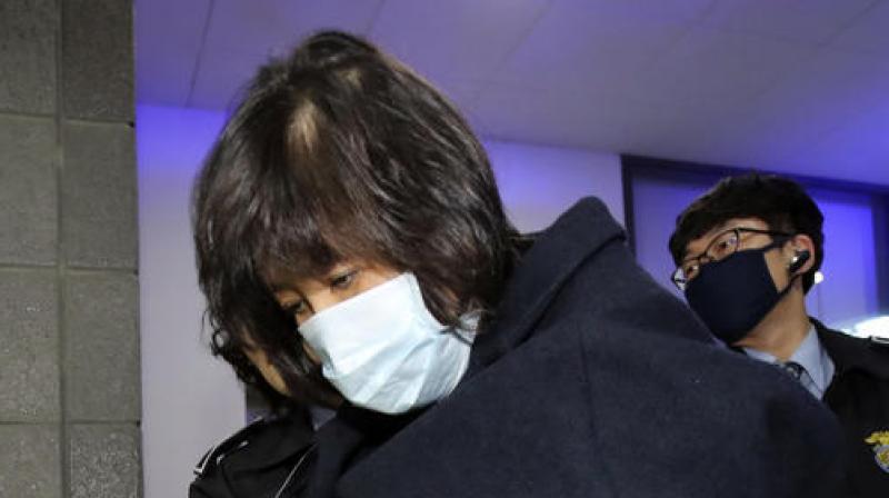 Choi Soon-sil, a woman at the center of a scandal that threatens the countrys president, arrives for questioning at the Seoul Central District Prosecutors Office in Seoul, South Korea. (Photo: AP)