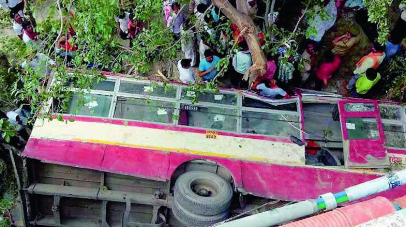 The wreckage of a bus after it fell from a bridge in Jaunpur, UP. (Photo: PTI)