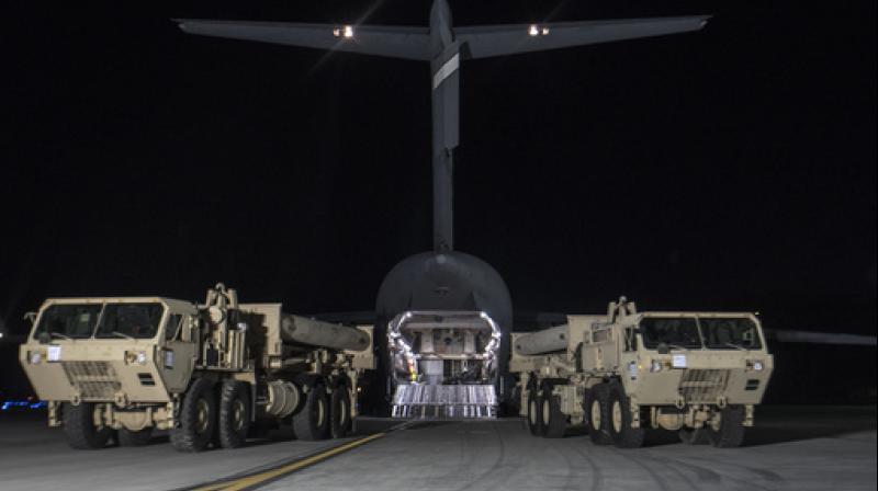 In this photo provided by US Forces Korea, trucks carrying US missile launchers and other equipment needed to set up the Terminal High Altitude Area Defense (THAAD) missile defense system arrive at the Osan air base in Pyeongtaek, South Korea. (Photo: AP)