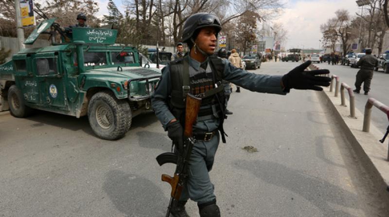 Security forces inspect the site of attack on a military hospital in Kabul, Afghanistan. (Photo: AP)
