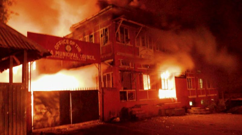 Naga tribals set ablaze the Kohima Municipal Council office and the office of the district collector to protest against Chief Minister TR Zeliangs refusal to meet their ultimatum, in Kohima on Thursday. (Photo: PTI)