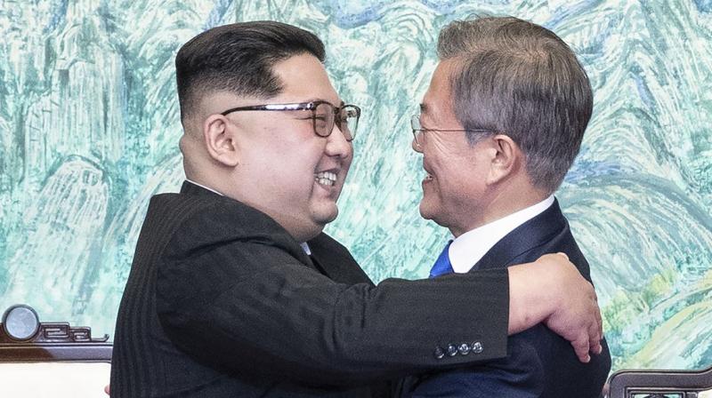 North Korean leader Kim Jong Un and South Korean President Moon Jae-in embrace each other after signing a joint statement at the border village of Panmunjom in the Demilitarised Zone on Friday. 	 AP