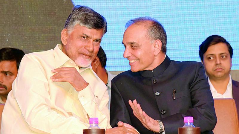 AP CM N Chandrababu Naidu speaking with Union minister of State for Human Resource, Satya Pal Singh during a conference in Vizag on Saturday. (Photo: DC)