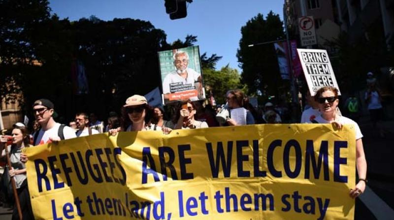 People march in Sydney welcoming refugees. (Photo: AFP)