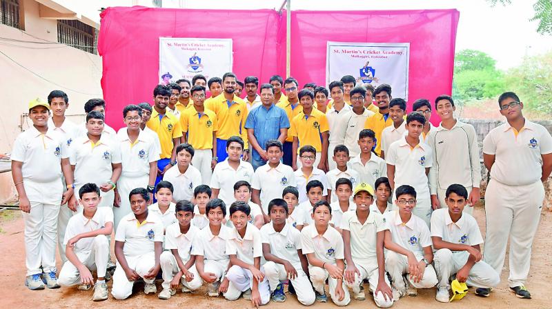 St Martins Cricket Academy cricketers pose with ICC panel umpire Ch Shamshuddin after conclusion of the summer camp in Malkajgiri, Hyderabad.