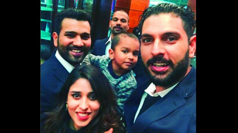 Yuvraj Singh with Rohit Sharma, Shikhar Dhawan, his wife Aysha and son Zoravar.