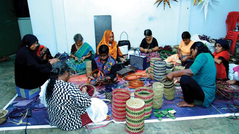 Women artisans engaged in creating various articles at KIDS. (DC)