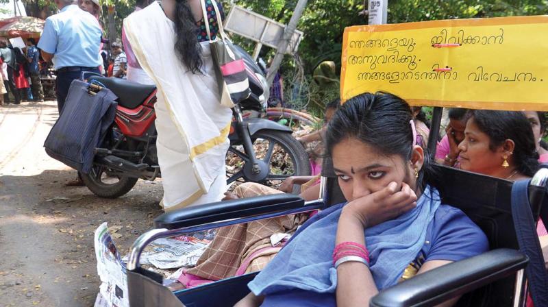 A special child takes part in a sit-in protest in-front of Ernakulam collectorate demanding an end to neglect to special school by the state government organised jointly by teachers, parents and students.  (SUNOJ NINAN MATHEW)