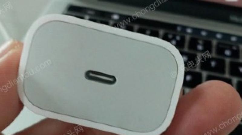 A leaked image shows off an iPhone charging adapter which is an 18W USB-C. (Image Credit: Macotakara)