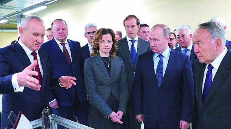 Kazakhstan President Nursultan Nazarbayev (right) and Russian President Vladimir Putin at Biocad plant