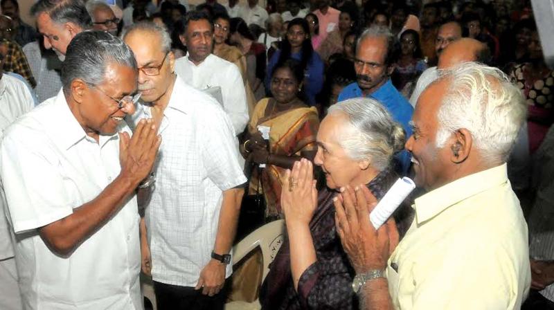 Chief Minister Pinarayi Vijayan greets historians Romila Thapar and M.R. Raghava Warrier at the curtain raiser public seminar in connection with the 77th session of the Indian History Congress at University Senate Hall in Thiruvananthapuram on Tuesday. Historian K.N. Panikker is also seen. (Photo: A.V. MUZAFAR)