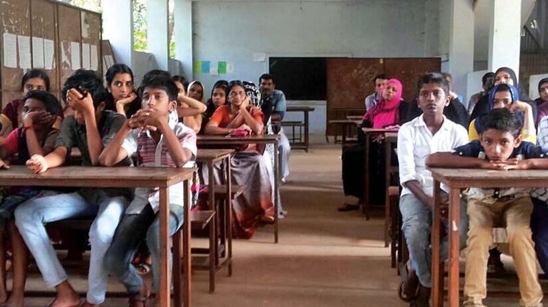 Students and parents attend an orientation session at Chemanchery UP School.