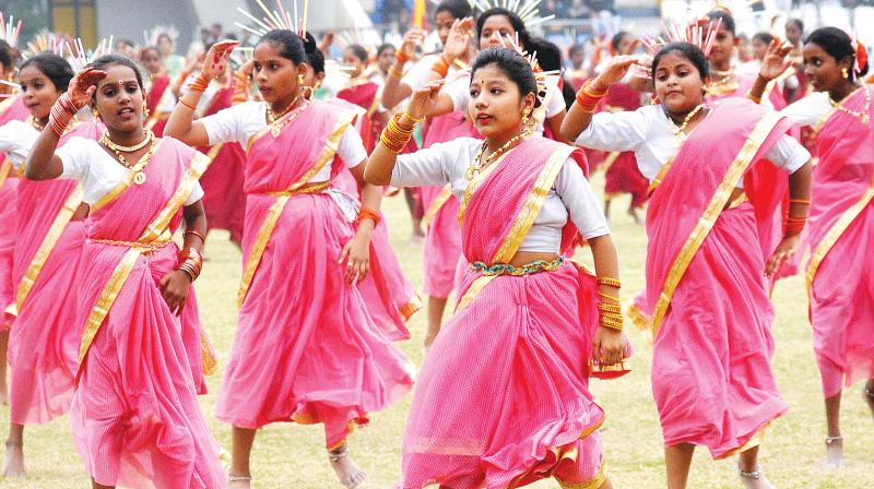 Children take part in a cultural programme on the occasion of 62nd Karnataka Rajyotsava celebrations at Shree Kanteerava Stadium in Bengaluru on Wednesday. (Photo: DC)