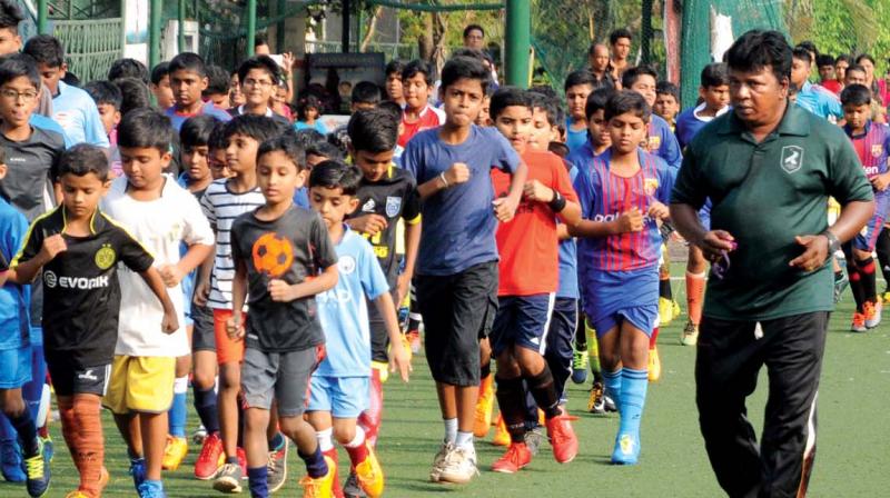 Children take part in a summer camp organised by the Regional Sports Centre at Kadavanthara in Kochi on Wednesday. (Photo: ARUN CHANDRABOSE)