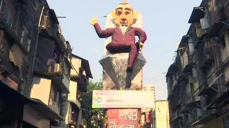 The residents of BDD Chawl in Mumbais Worli area have created a 58-feet high effigy of Nirav Modi, symbolising the evil character of Holika, to burn it as a part of the festivals tradition. (Photo: ANI | Twitter)