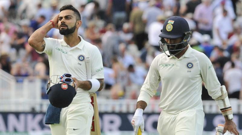 Virat Kohli, whose superb first-innings 149 was the star batsmans maiden Test century in England, was 43 not out and Dinesh Karthik unbeaten on 18 at stumps on Day three of what has been a riveting first Test. (Photo: AP)