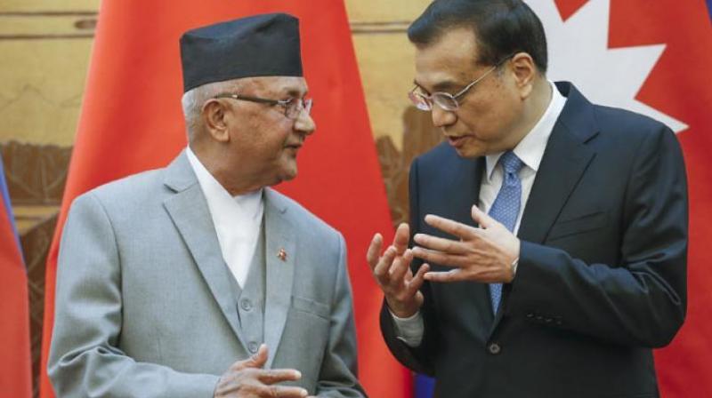 Chinese Premier Li Keqiang (right) with Nepals Prime Minister Khadga Prasad Oli. (Photo: AP)