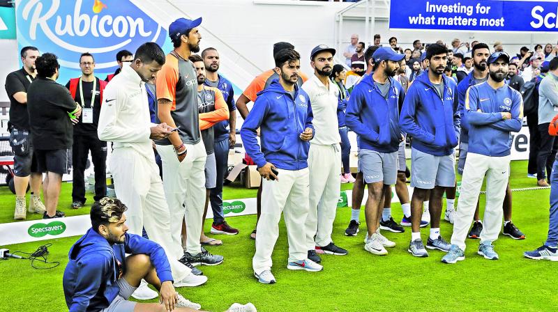 Members of Team India look dejected during the  post-match ceremony.     Image: AP