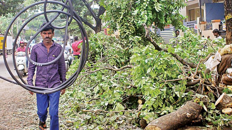 Double Road is only one of many roads with dangling OFC cables, points out Mr Ganesh, a resident of Vijaynagar.