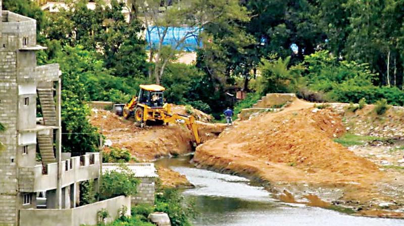 A bulldozer near Sadarmangala Lake bed