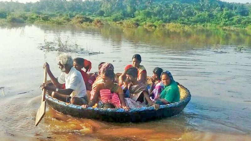 Bogipuram villagers, using a coracle, cross the river in spate. (Photo: DC)