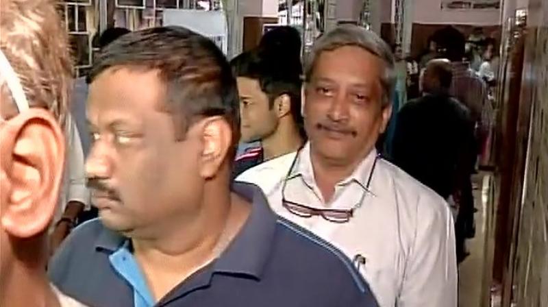 Defence Minister Manohar Parrikar standing in queue at an election booth in Goa. (Photo: ANI Twitter)