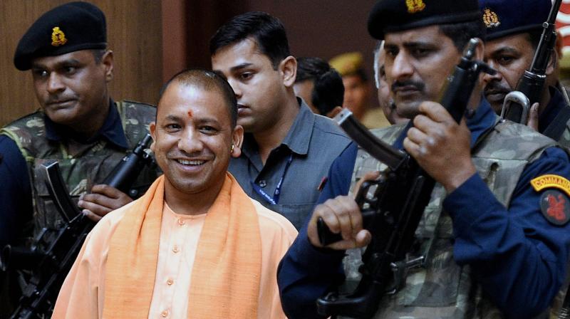 UP Chief Minister Yogi Adityanath coming out after the cabinet meeting at Lok Bhawan in Lucknow on Tuesday. (Photo: PTI)