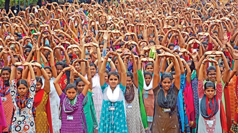 Students of Valliammal College for women perform yoga on Tuesday during International Yoga Day Celebrations. (Photo: DC)