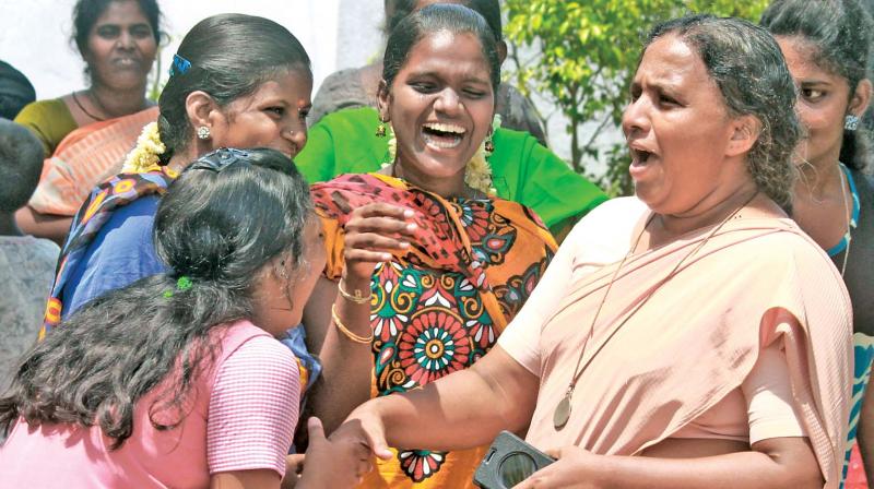 A teacher greets her students after learning of their scores in the class X examinations, results of which were declared on Friday. (Photo: DC)