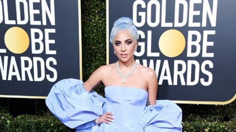 Pop superstar Lady Gaga, dressed in lavender, leading a trend for old school glamor. (Photo credit: Twitter)