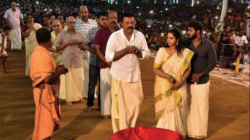 Rajya Sabha MP Suresh Gopi and family members take part in Kuthiyotta Polivu at Chettikulangara temple on Wednesday.