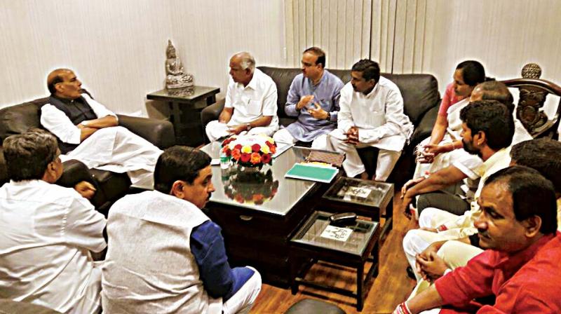 A delegation led by BJP state president B.S. Yeddyurappa met Union Home Minister Rajnath Singh at Delhi on Wednesday and petitioned him about the collapse of law and order, especially the killing of RSS and BJP workers