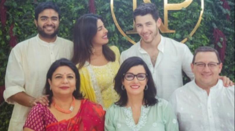 Priyanka Chopra and Nick Jonas with their families. (Twitter Screengrab/ @priyankachopra)