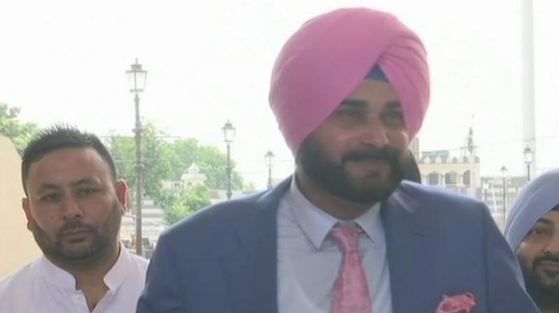 Responding to a question at Soch Se Soch Ki Ladai event organised by Youth Congress in Ajmer city of Rajasthan, Sidhu said sportsmen and artists break barrier and bring people closer. (Photo: Twitter | @ANI)