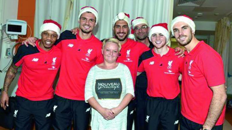 Jurgen Klopp and his Liverpool players took some time out of their busy club duties to provide some festive cheer to those in need.