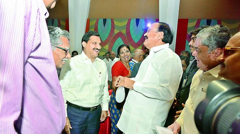 M. Venkaiah Naidu with former Union minister  Y. Sujana Chowdary at a meeting on his successful completion of a year as the Vice-President, at Cyber conventions in Hitex on Tuesday.