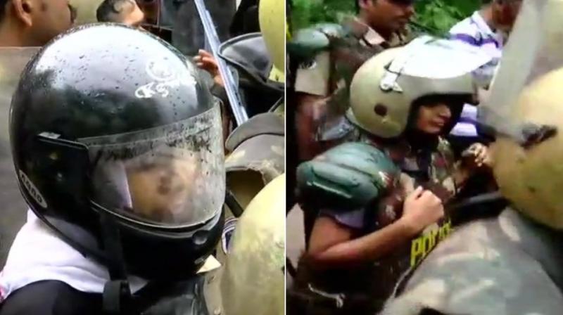 Two women, journalist Kavitha Jakkal of Hyderabad based Mojo TV and Kochi resident Rehana Fatima, have started walking towards Sabarimala temple with tight police escort amid strong protests by devotees opposing entry of women of menstrual age into Lord Ayyappa temple in Kerala. (Photo: Twitter | ANI)