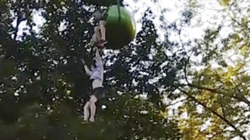 In this June 24, 2017, image made from a video provided by Leeann Winchell, a 14-year-old girl falls from an amusement park ride at Six Flags Great Escape Amusement Park in Queensbury, N.Y. (Photo: AP)
