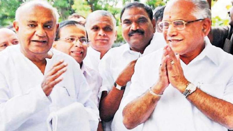 A file photo of JD(S) supremo H.D. Deve Gowda with State BJP president B.S. Yeddyurappa. (Photo: DC)