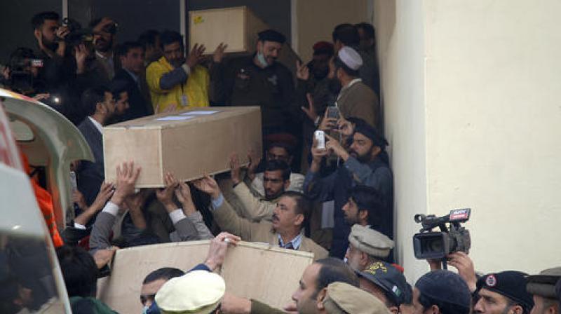 People move bodies of plane crash victims to ambulances en route to Islamabad, at a hospital in Abbotabad. (Photo: AP)