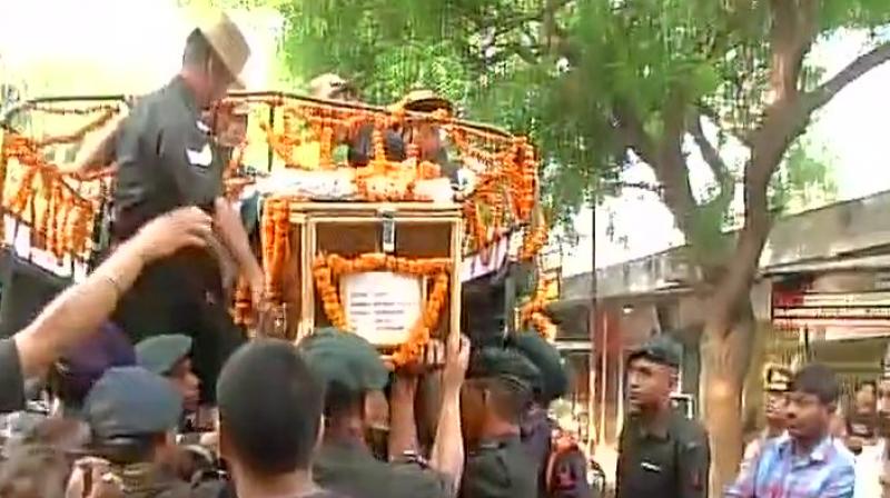 From the captains residence, the mortal remains were taken to Sidhnath Ghat in a truck where he was cremated with full military honours. (ANI Twitter)