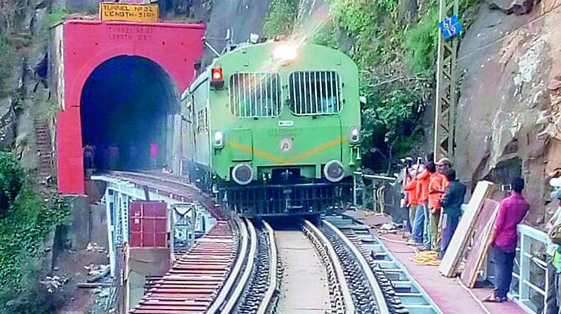 Technical staff inspect the trial run of the train on the bridge along KK Line in Visakhapatnam on Friday. (Photo: DC)